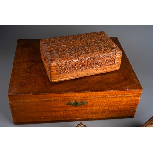 832 - Four wooden boxes to include a carved wood one, pokerwork , bone and various wood inlayed one and a ... 