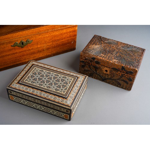 832 - Four wooden boxes to include a carved wood one, pokerwork , bone and various wood inlayed one and a ... 