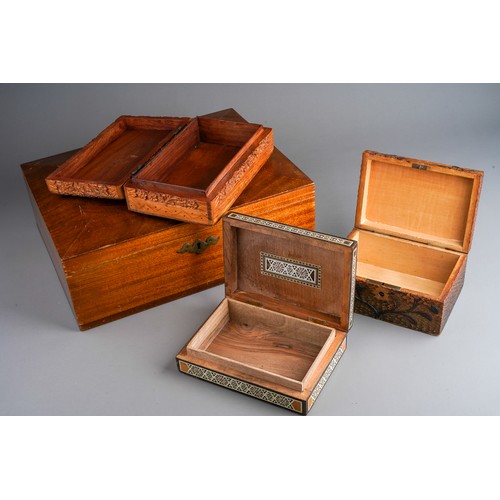 832 - Four wooden boxes to include a carved wood one, pokerwork , bone and various wood inlayed one and a ... 