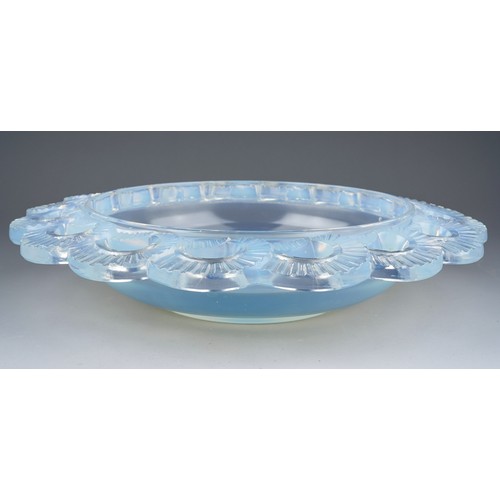 836 - A Pierre D`Avesn opalescent glass bowl, moulded with scrolling edges. Signed to base. 40cm. diam.