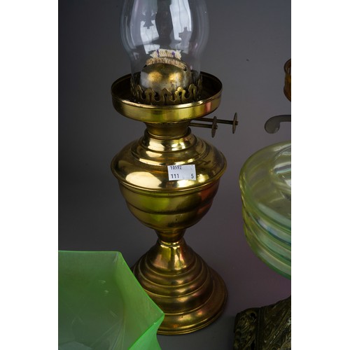 841 - Two brass base oil lamps together with 2 green glass shades and a crystal droplet shade