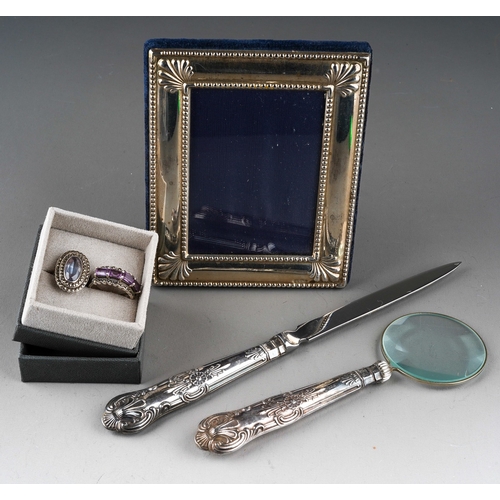 877 - Two 925 silver mounted and glass stone cocktail rings together with a Kings pattern letter opener an... 