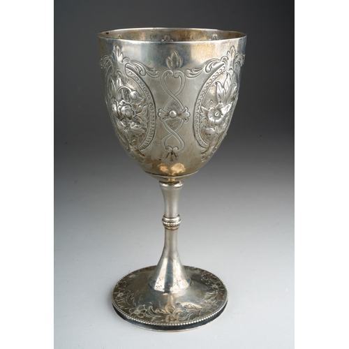 880 - A Victorian silver goblet, chased with floral oval panels, hallmarked by TB, London, 1874, approx we... 