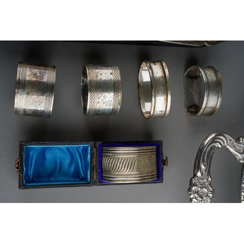 890 - Two early 20th Century silver napkin rings, hallmarked together with assorted plate to include two g... 