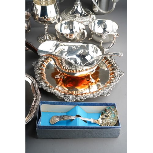 894 - Large collection of silver plated items to include trays, tea pot, candle stick, cutlery etc.