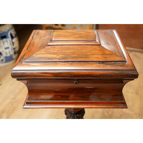 897 - A Victorian rosewood teapoy, the sarcophagus top with hinged cover enclosing a pair of velvet lined ... 