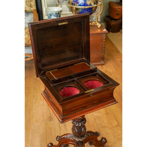 897 - A Victorian rosewood teapoy, the sarcophagus top with hinged cover enclosing a pair of velvet lined ... 