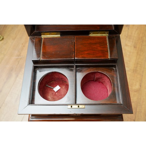 897 - A Victorian rosewood teapoy, the sarcophagus top with hinged cover enclosing a pair of velvet lined ... 