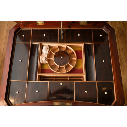 899 - A Victorian mahogany Sewing Table, the quarter veneered top opens to reveal a fitted interior with m... 