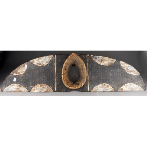 957 - Tribal interest: a carved African wooden butterfly mask in the form of outstretched wings, face shap... 