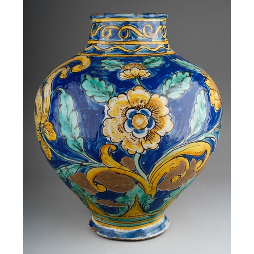 960 - A 19th century faience jar, polychrome decorated with yellow flowers on a blue ground, substantial c... 