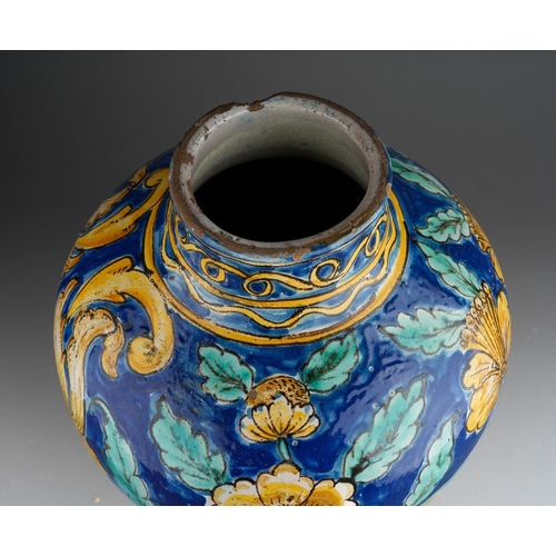 960 - A 19th century faience jar, polychrome decorated with yellow flowers on a blue ground, substantial c... 