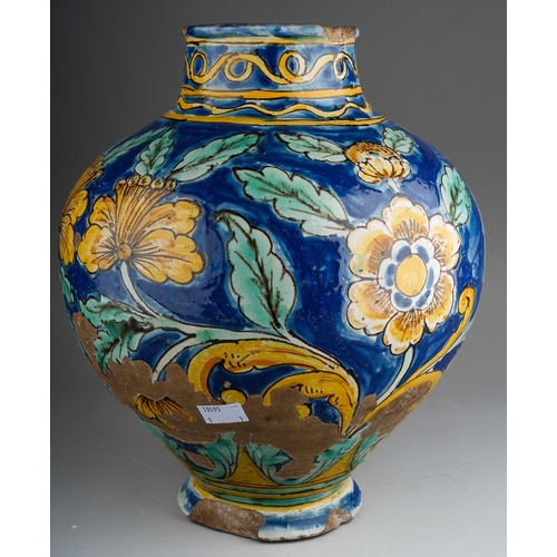 960 - A 19th century faience jar, polychrome decorated with yellow flowers on a blue ground, substantial c... 