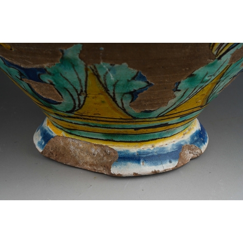 960 - A 19th century faience jar, polychrome decorated with yellow flowers on a blue ground, substantial c... 