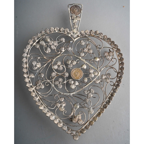 963 - A Continental white metal filigree model of a carriage on granite stand together with a heart shaped... 