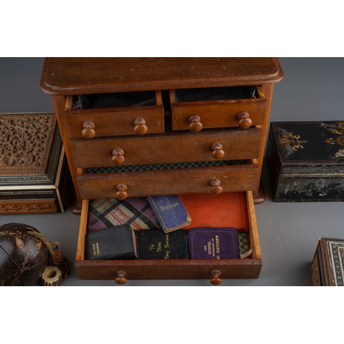 965 - A collection of treen boxes, miniature Victorian style chest of drawers, nut, three 19th century pap... 