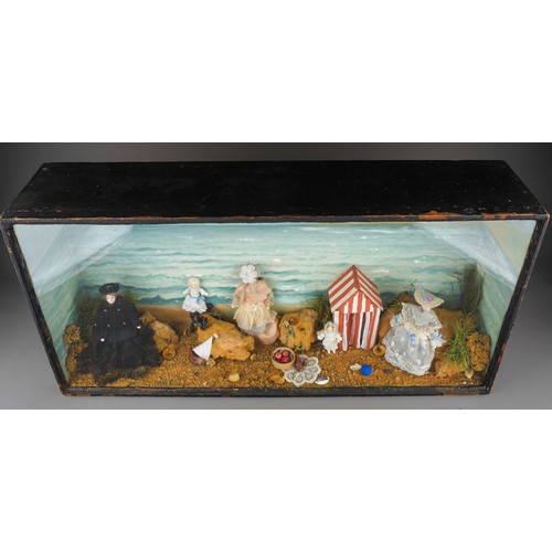 968 - A diorama depicting Queen Victoria with children on an Isle of Wight beach, each figure with painted... 