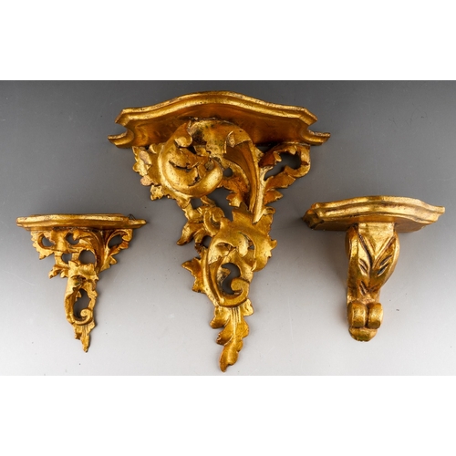 985 - Three early 20th century Italian giltwood and gesso wall brackets, all of foliate design, height of ... 