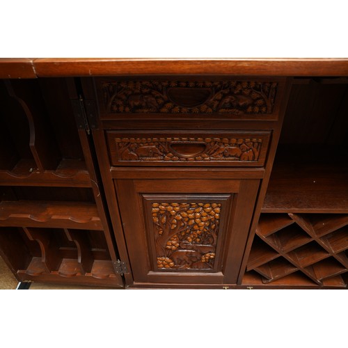 990 - A second half 20th century Chinese hardwood carved bar, the rectangular double hinged top opening ov... 