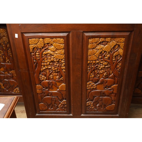 990 - A second half 20th century Chinese hardwood carved bar, the rectangular double hinged top opening ov... 