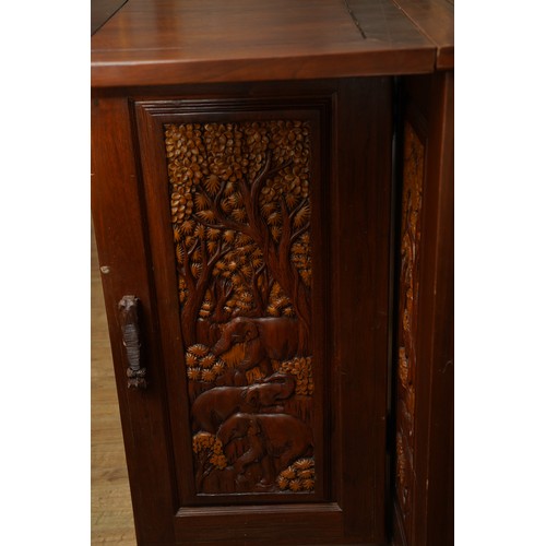 990 - A second half 20th century Chinese hardwood carved bar, the rectangular double hinged top opening ov... 