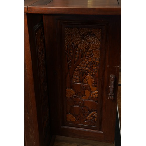 990 - A second half 20th century Chinese hardwood carved bar, the rectangular double hinged top opening ov... 