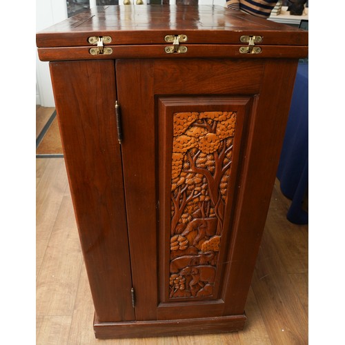 990 - A second half 20th century Chinese hardwood carved bar, the rectangular double hinged top opening ov... 