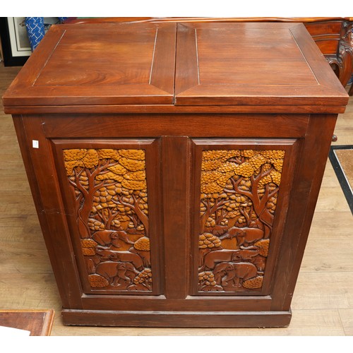 990 - A second half 20th century Chinese hardwood carved bar, the rectangular double hinged top opening ov... 