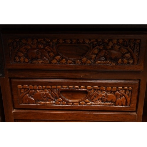 990 - A second half 20th century Chinese hardwood carved bar, the rectangular double hinged top opening ov... 