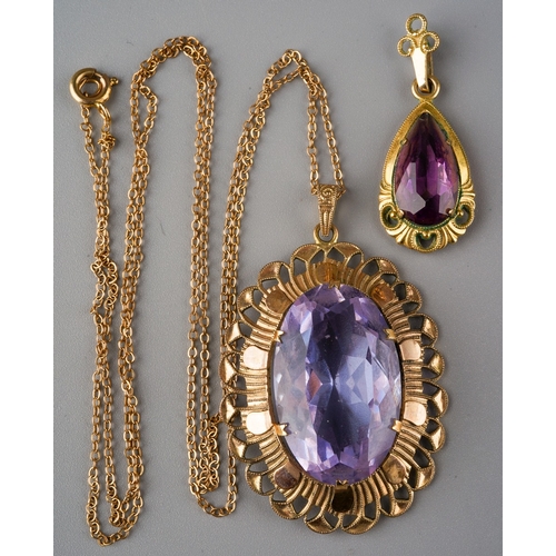 1009 - Two pendants and one chain. One pendant set with a pear shape purple paste, surmount stamped rolled ... 