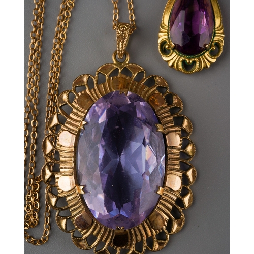 1009 - Two pendants and one chain. One pendant set with a pear shape purple paste, surmount stamped rolled ... 