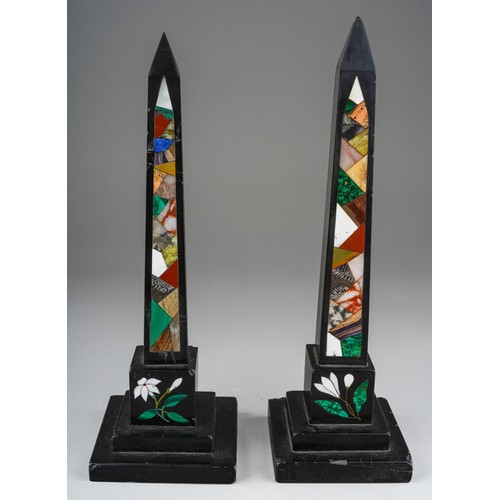 838 - A pair of Ashbourne obelisks inlaid with various coloured stones. Approx. 25 cm tall