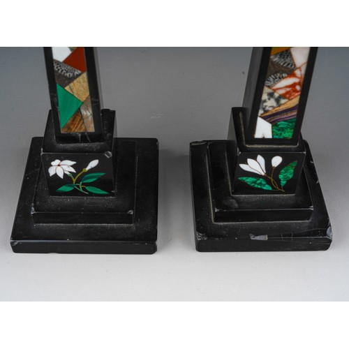 838 - A pair of Ashbourne obelisks inlaid with various coloured stones. Approx. 25 cm tall