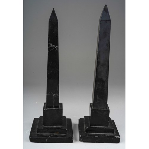 838 - A pair of Ashbourne obelisks inlaid with various coloured stones. Approx. 25 cm tall