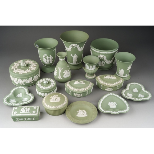 147 - A collection of Wedgwood pale green jasperware, including vases, assorted trinket boxes, pin dishes,... 