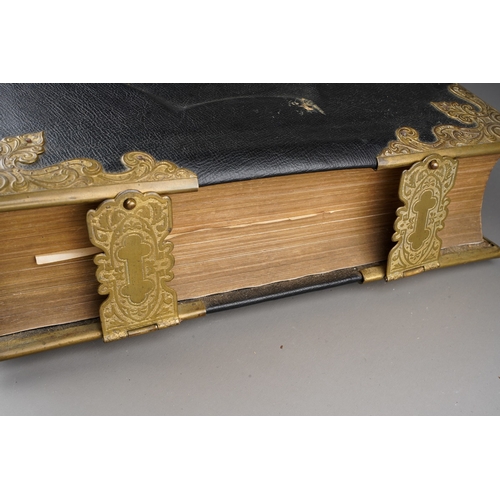 160 - A Victorian Browns Self-Interpreting leather and brass bound Family bible, with register to front, r... 