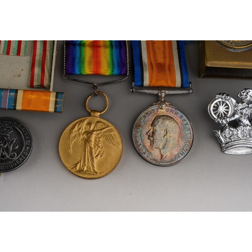 164 - Two WWI medals in original box, awarded to 190131 GNR. J.H.YATES R.A., together with a trench art ma... 