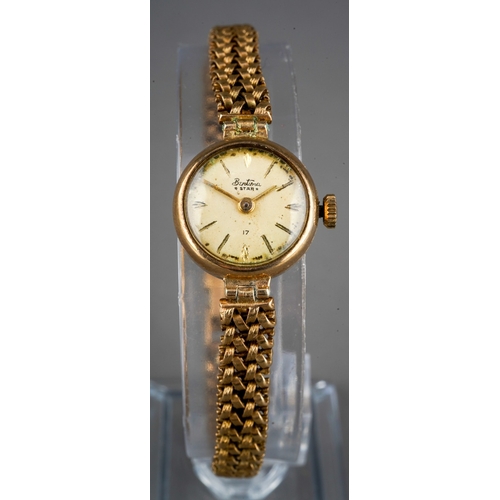 176 - 9 ct gold ladies Bentima star wrist watch with a 9ct strap, gross weight 14.7g