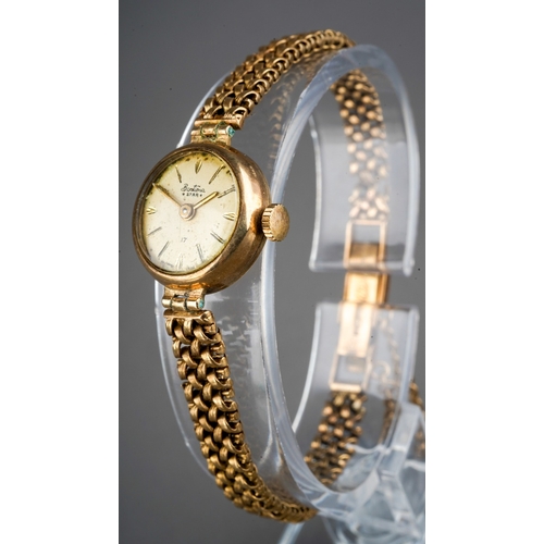 176 - 9 ct gold ladies Bentima star wrist watch with a 9ct strap, gross weight 14.7g