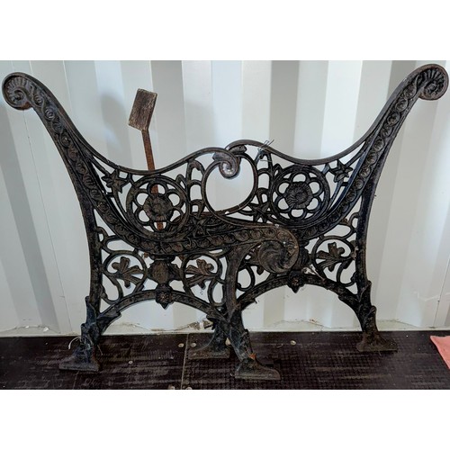 181 - Pair of cast iron bench ends decorated with flower details, approx. 78 cm tall at back