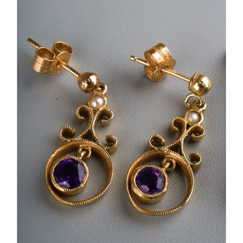 695 - A collection of three pairs of earrings, to include a pair of 9ct yellow gold amethyst cabochon earr... 