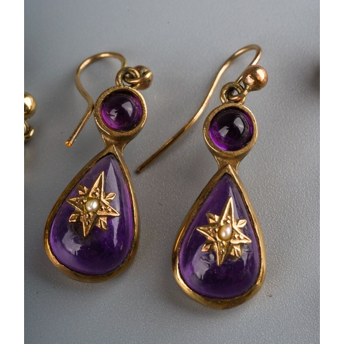 695 - A collection of three pairs of earrings, to include a pair of 9ct yellow gold amethyst cabochon earr... 