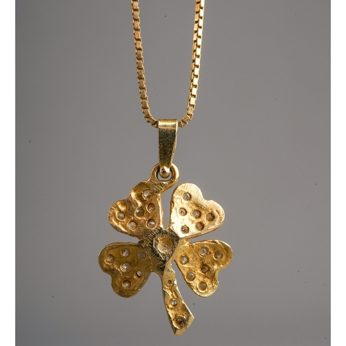 696 - A diamond set four leaf clover pendant with chain, the pendant set with a central round brilliant cu... 