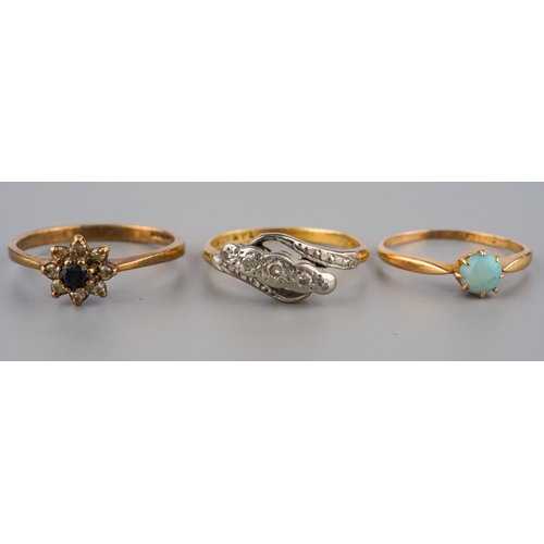 706 - Three gem set and diamond rings, to include an early to mid 20th century 18ct gold Swedish opal cabo... 