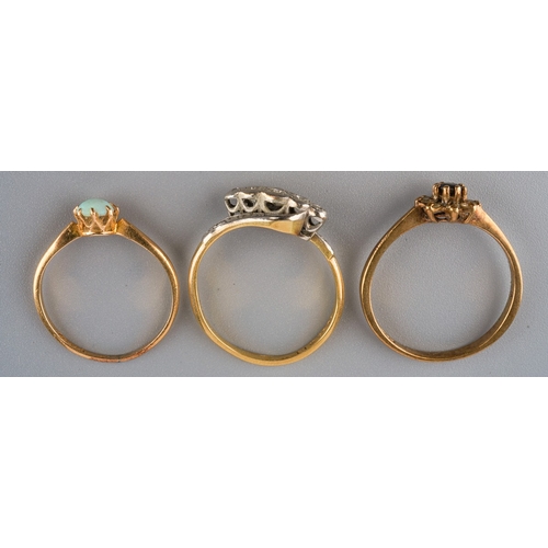 706 - Three gem set and diamond rings, to include an early to mid 20th century 18ct gold Swedish opal cabo... 