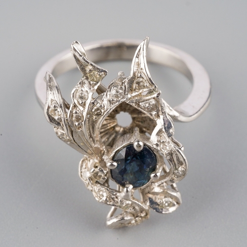 709 - A sapphire and diamond dress ring, set with an oval sapphire and single cut diamonds, approx ring si... 