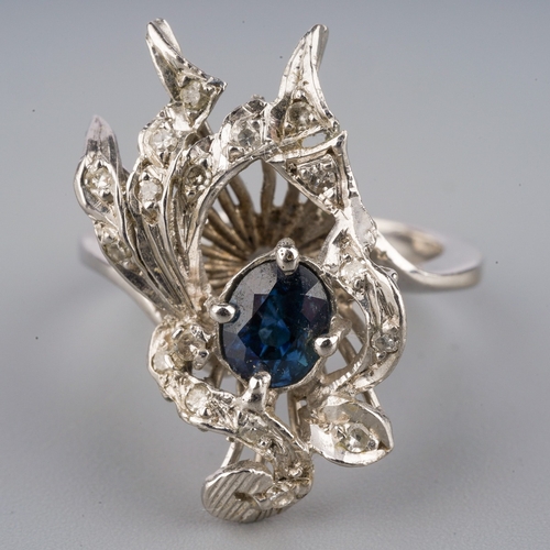 709 - A sapphire and diamond dress ring, set with an oval sapphire and single cut diamonds, approx ring si... 