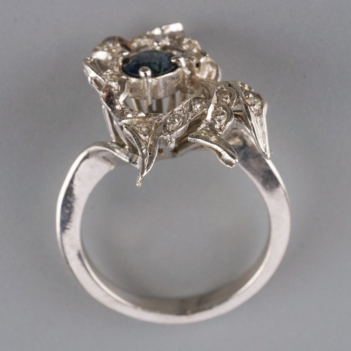 709 - A sapphire and diamond dress ring, set with an oval sapphire and single cut diamonds, approx ring si... 