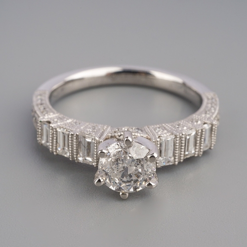 713 - A diamond ring, set with a modern round brilliant cut diamond, measuring approx 5.64mm diameter, to ... 