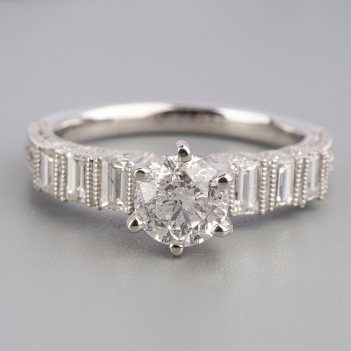 713 - A diamond ring, set with a modern round brilliant cut diamond, measuring approx 5.64mm diameter, to ... 